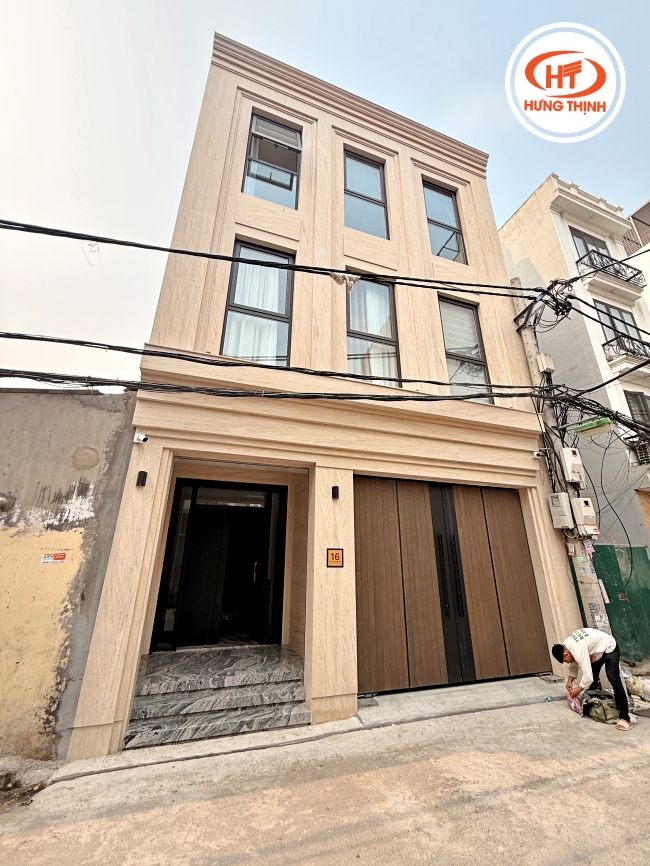 Đá Marble Moca Cream (vân gỗ cát) được ốp full 3 tầng mặt tiền 