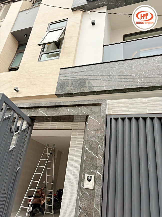 Thi công mặt tiền đá Marble Moca Cream