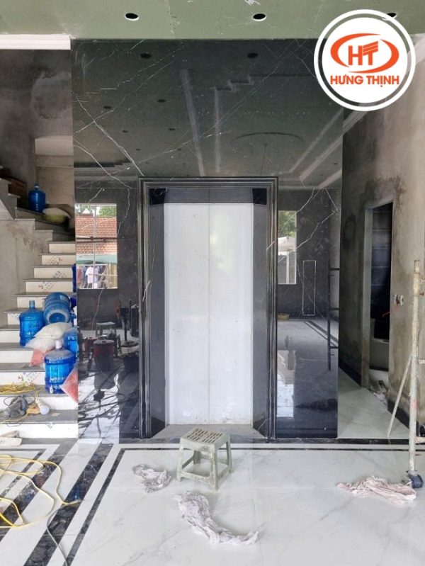 Thực tế đá ốp thang máy Marble Đen Chỉ Trắng